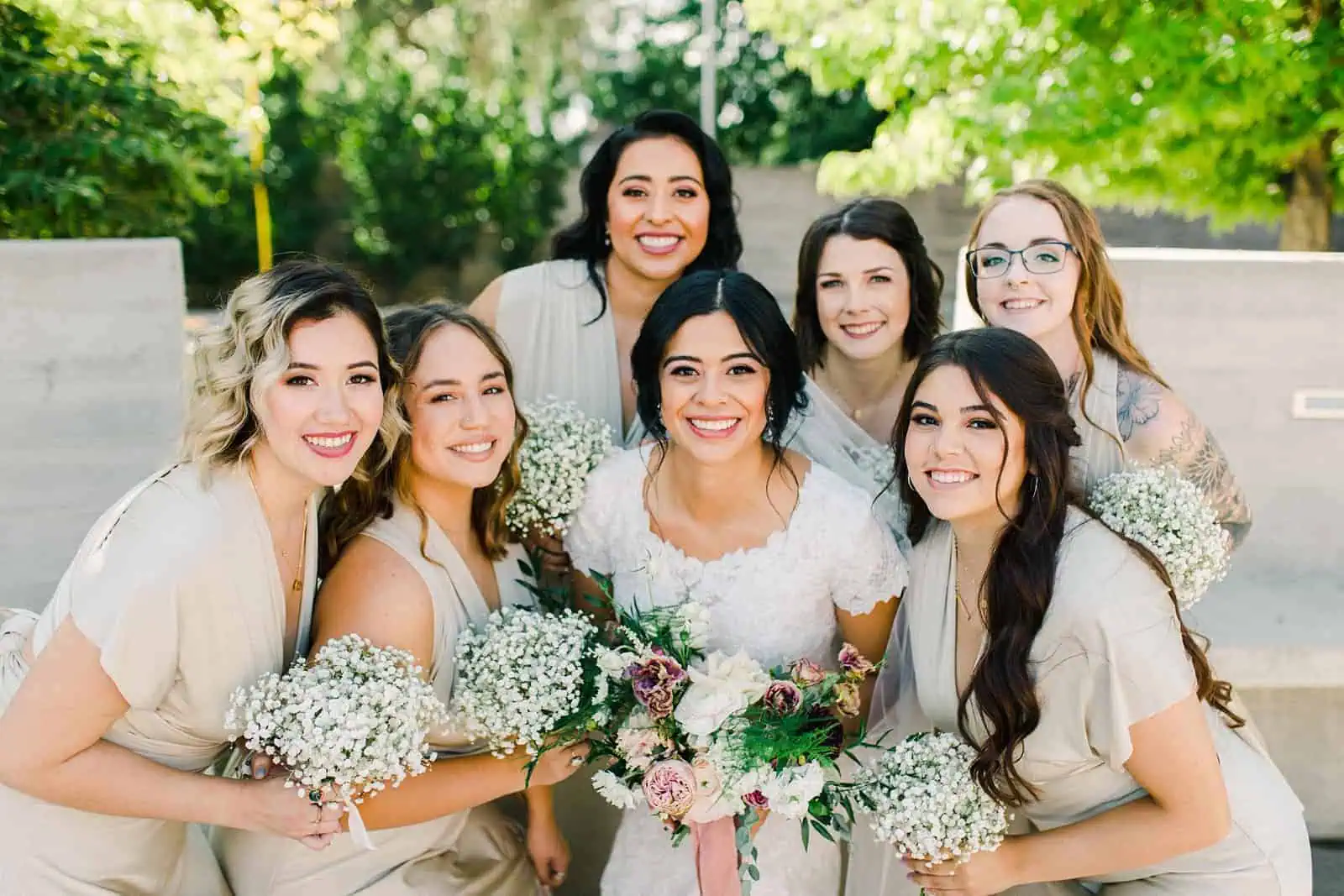 bride and bridesmaids wearing gold champagne long maxi bridesmaids dresses with baby's breath bouquets