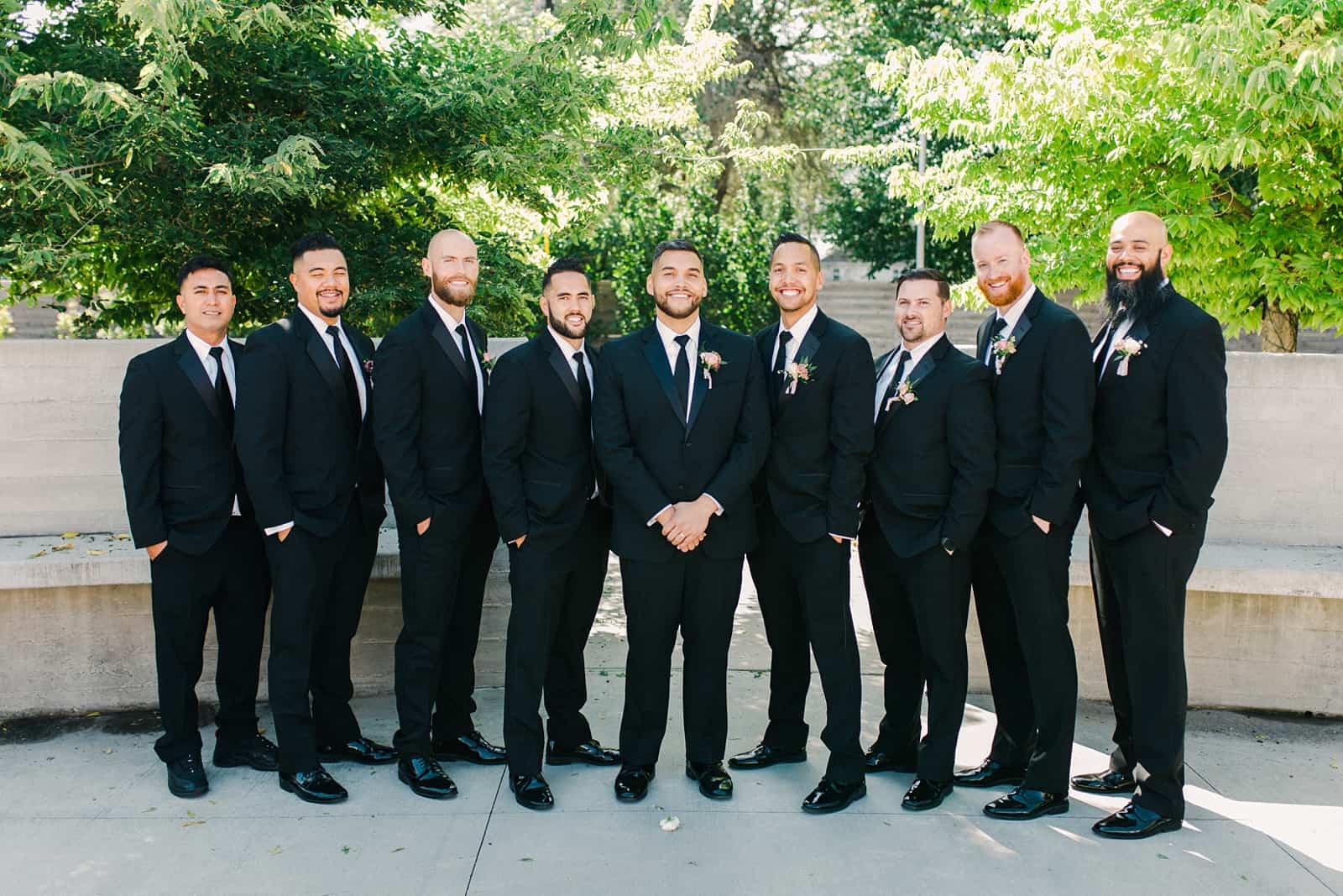 Groom and groomsmen in classic black tuxedos