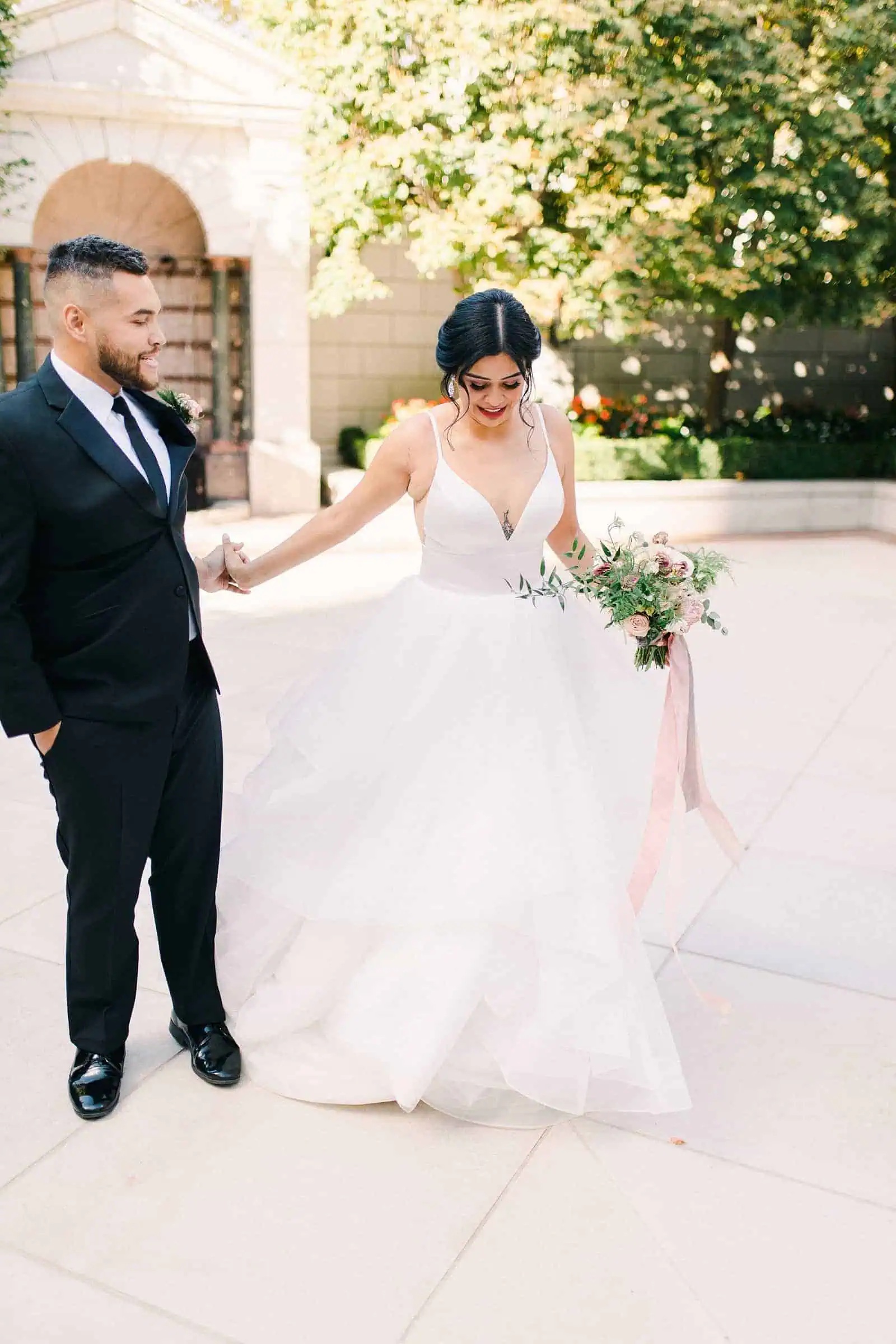 Bride wearing v neck and tulle wedding dress