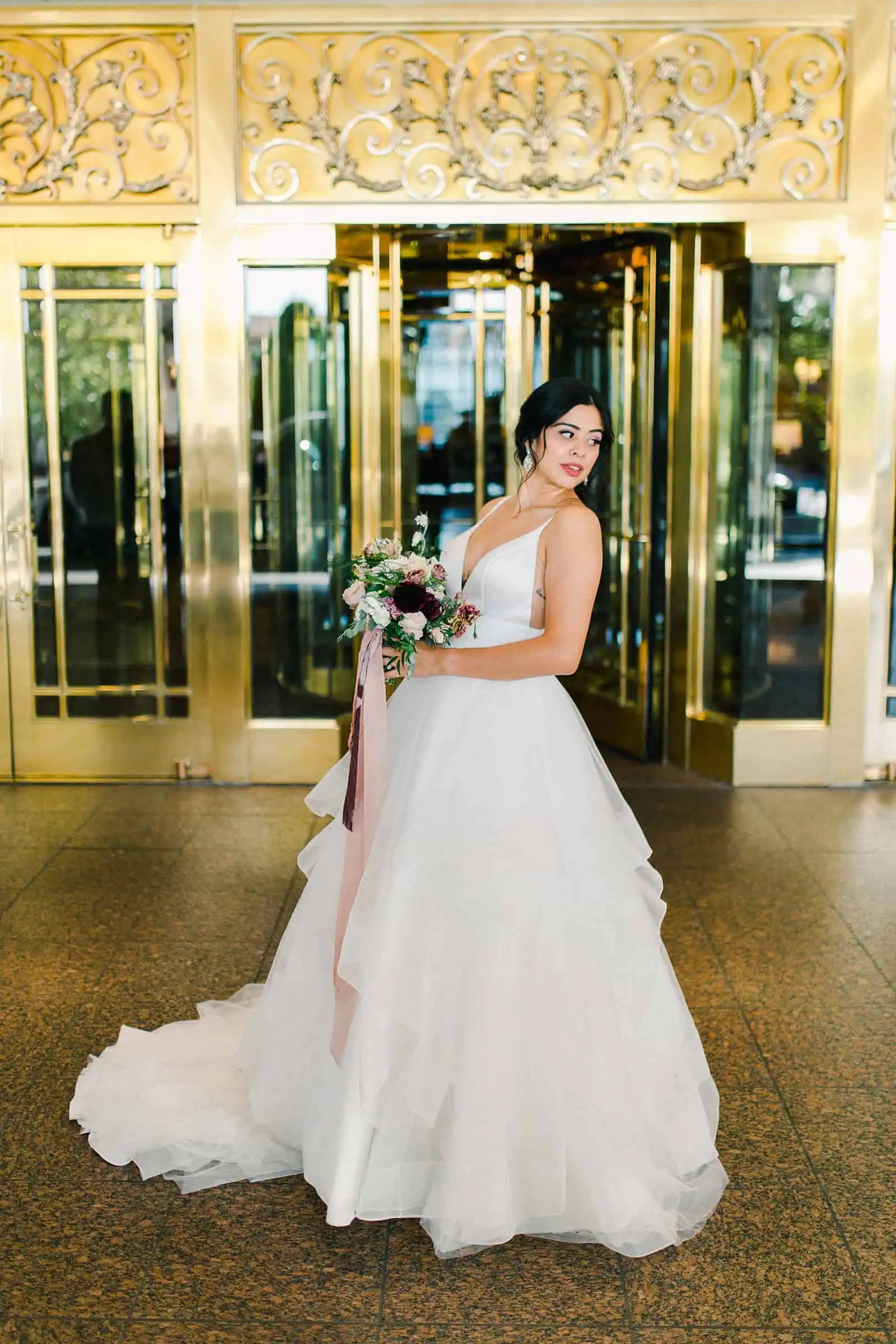 Bride with tulle skirt and long train outside the Grand America Hotel