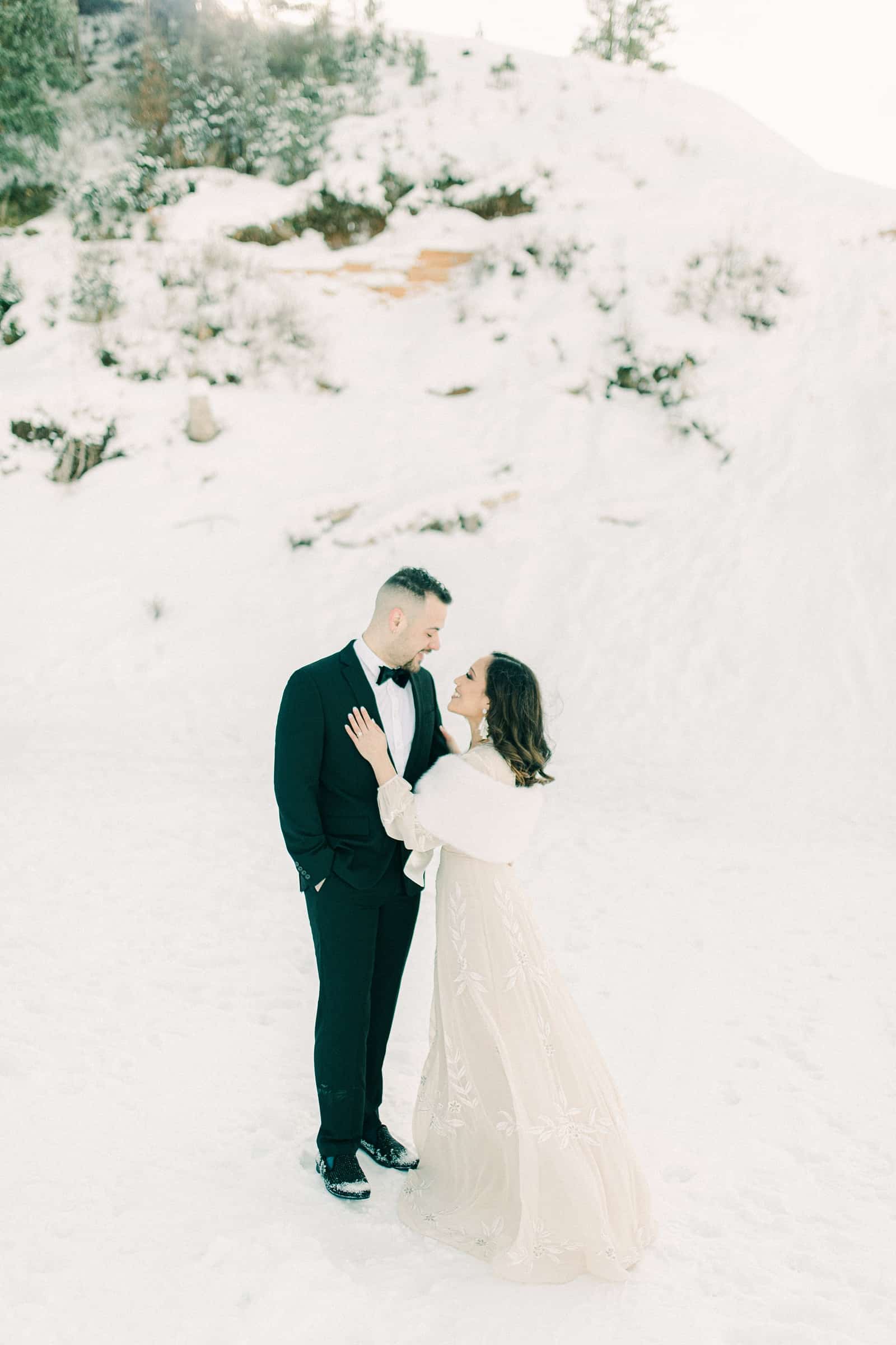 Bride and groom winter wedding, long flowy maxi dress