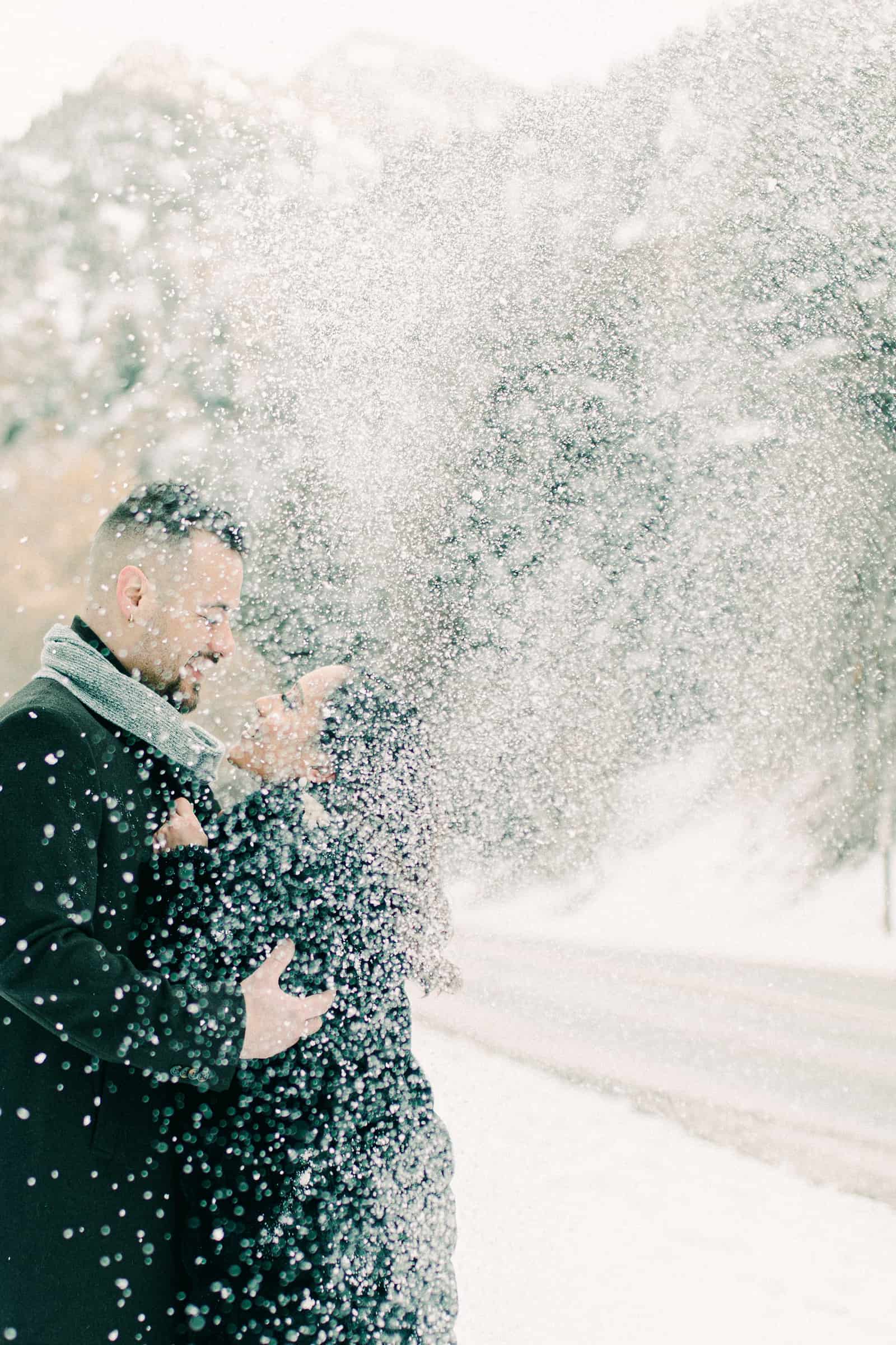 Playing in the snow, winter engagement photography