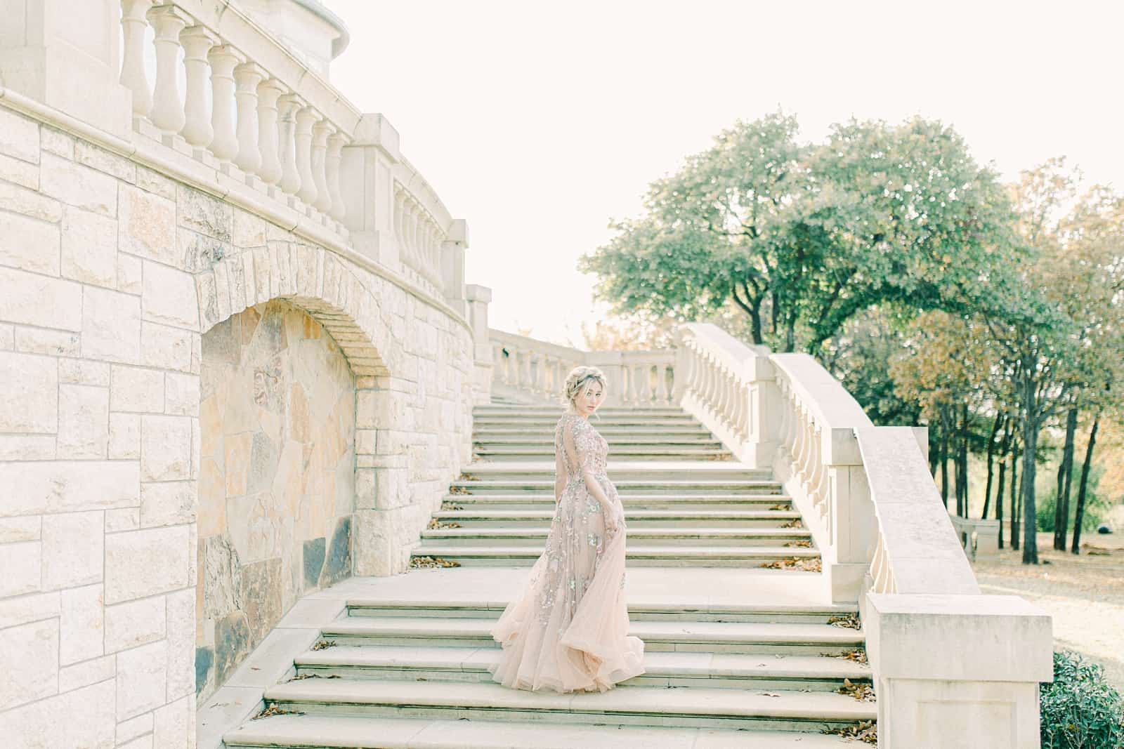 European inspired wedding venue, bride on sweeping marble staircase