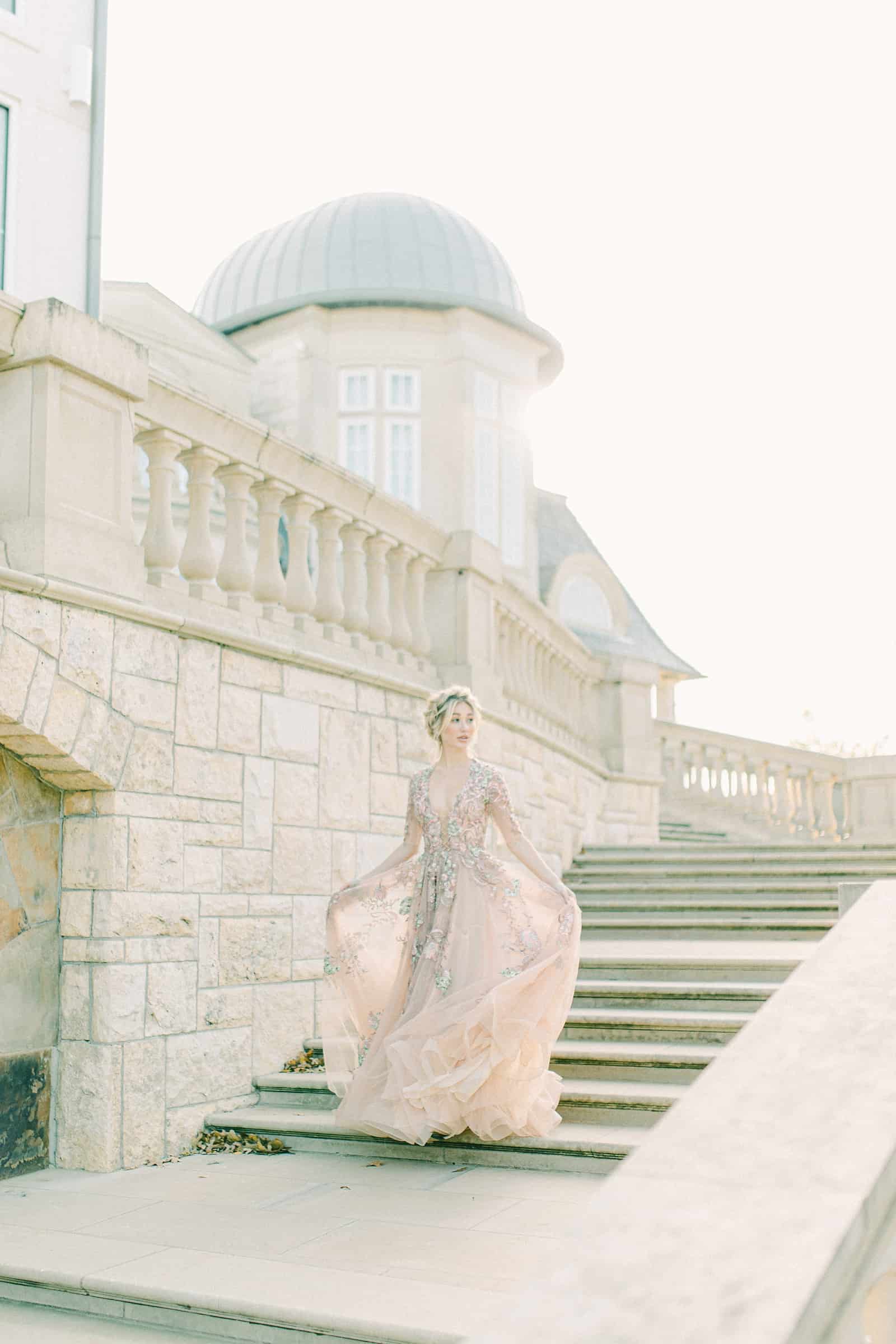 European mansion bride on staircase, destination wedding in Paris