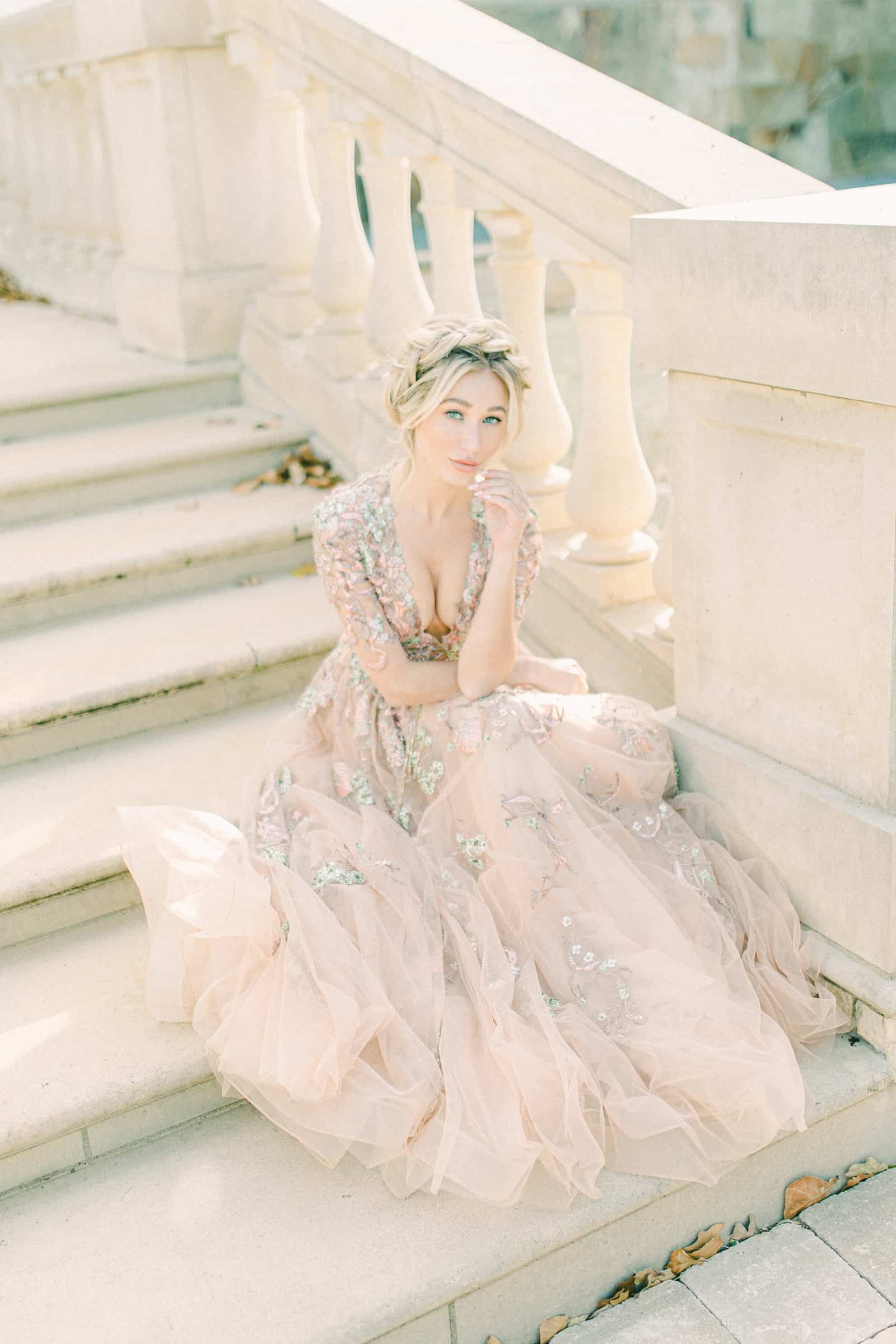 Bride wearing blush wedding dress awith floral embroidery and plunging neckline, YSA Makino couture wedding dress