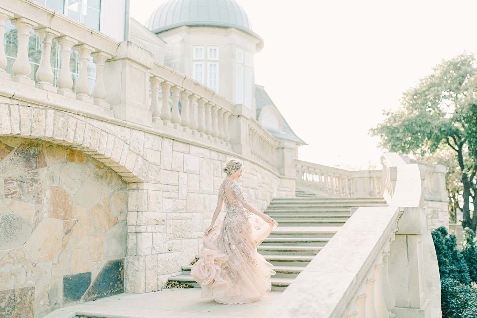 Bride twirling on steps of staircase in Rome, Italy