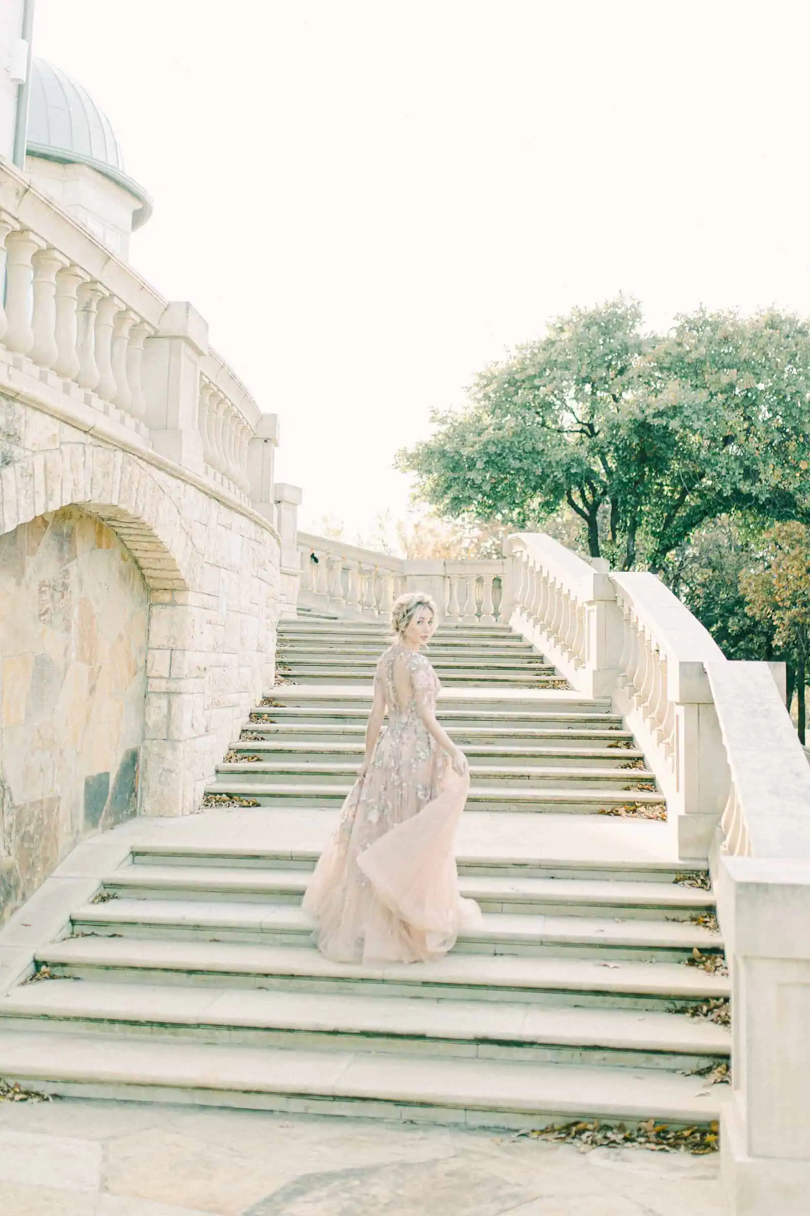 European mansion bride on staircase, destination wedding in Paris