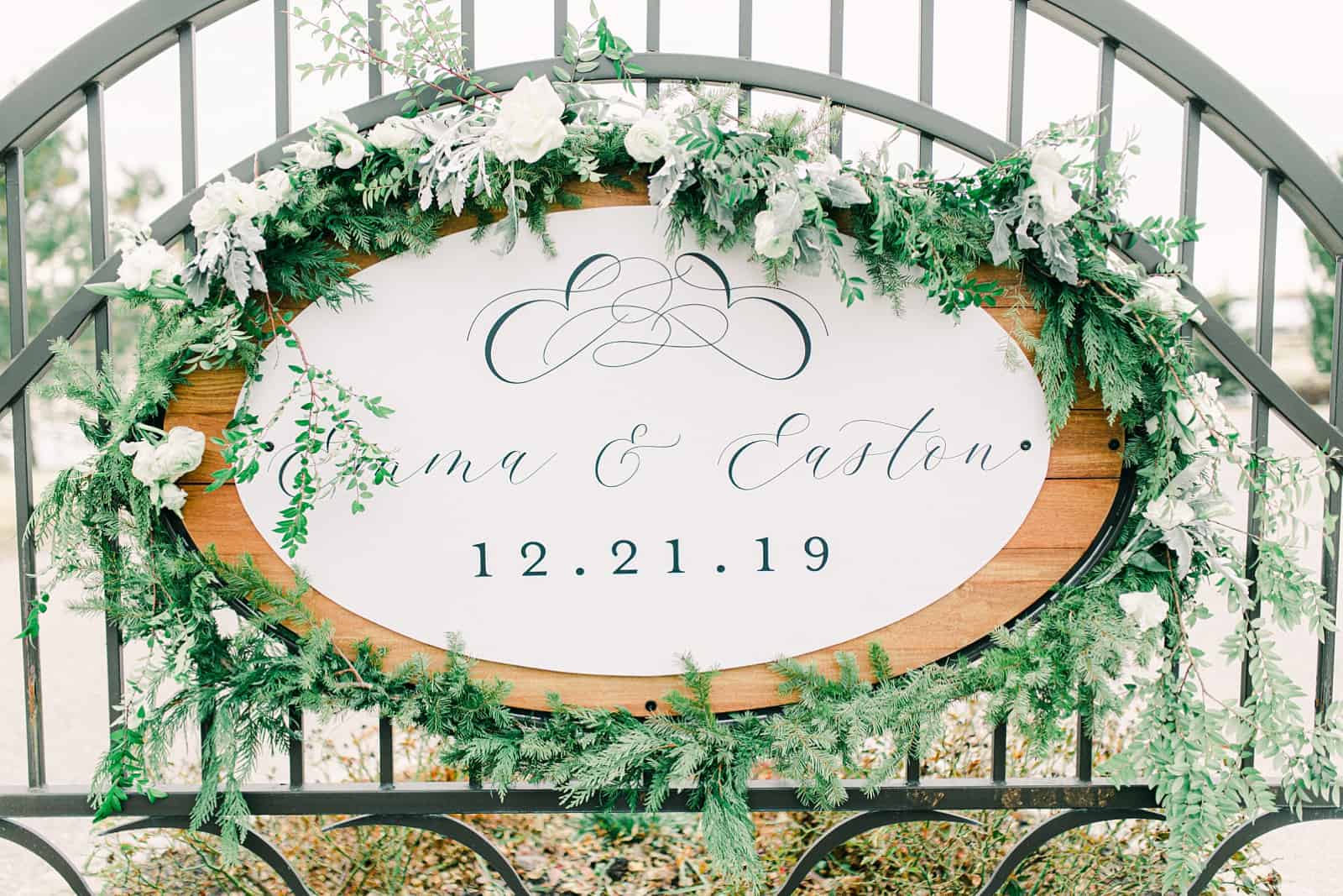 All white winter wedding with calligraphy wedding sign