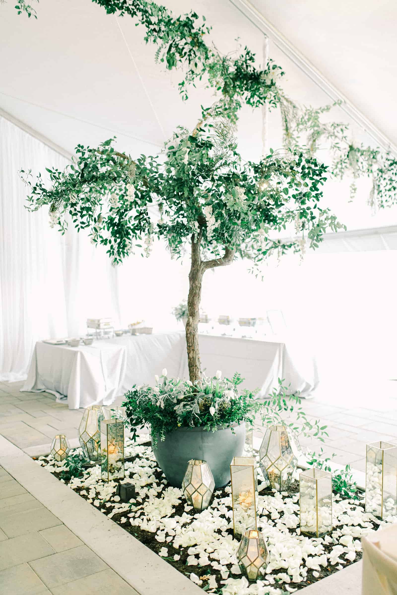 Luxury winter wedding at Willowbridge Estate in Boise, Idaho, white tent reception with greenery tree centerpieces and candles