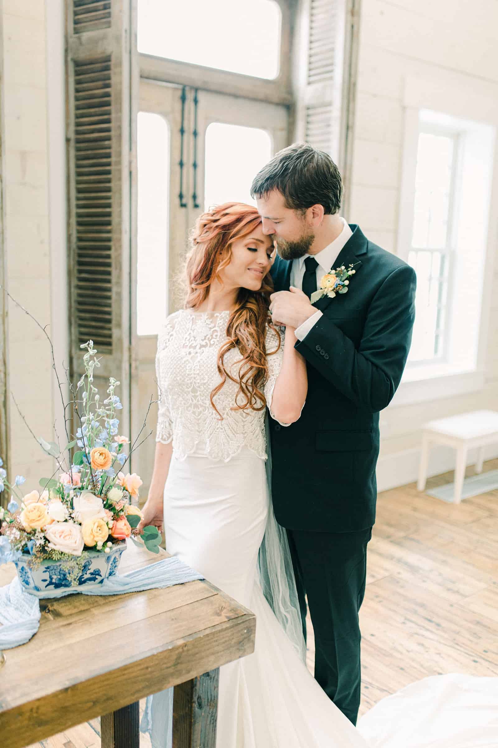 Bride and groom in modern barn wedding venue, Utah wedding photography