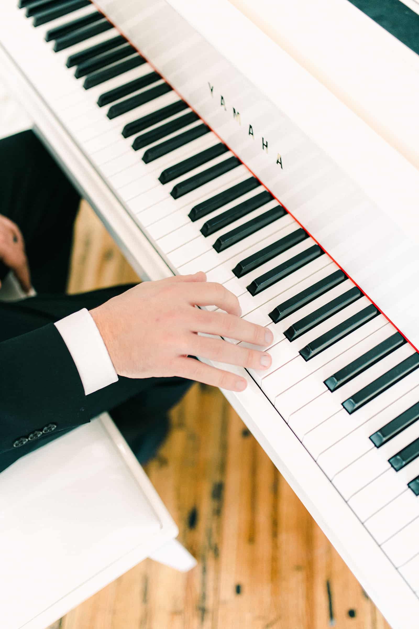 Groom serenades bride at the piano, special wedding song