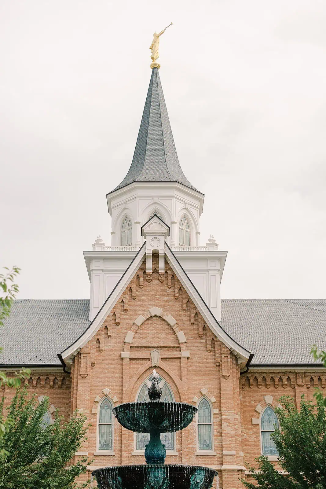 Branson Maxwell church with steeple and fountain in front.