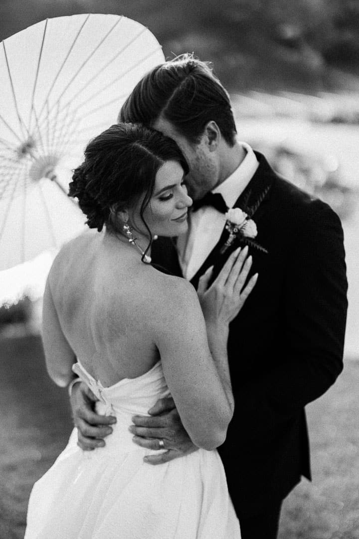 Bride and groom sharing a romantic moment during their wedding celebration.