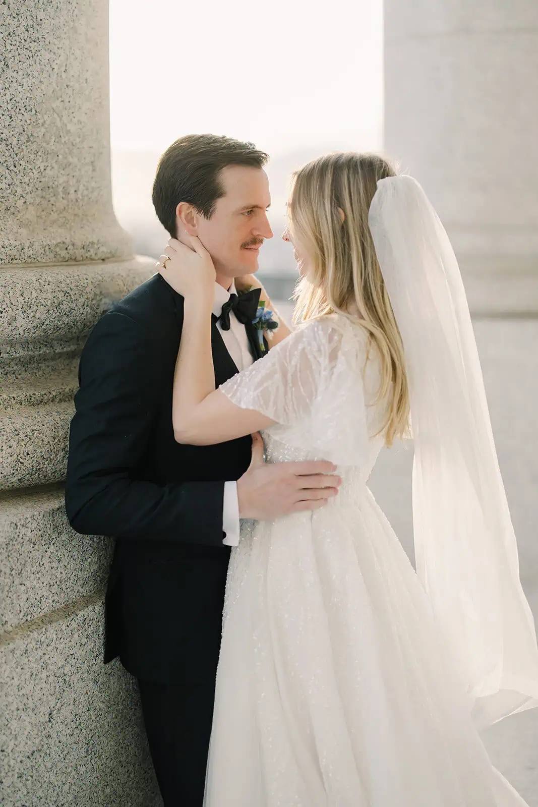 Bride and groom sharing a romantic moment outdoors at Branson Maxwell.