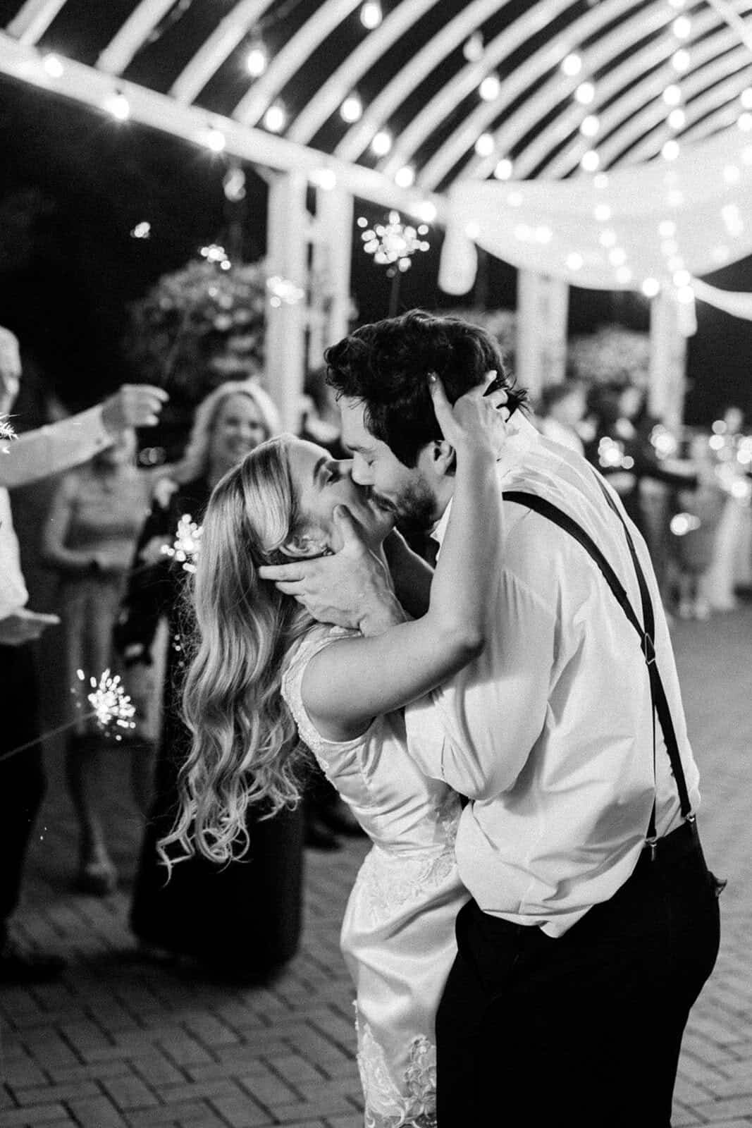 Romantic couple dancing at wedding reception.