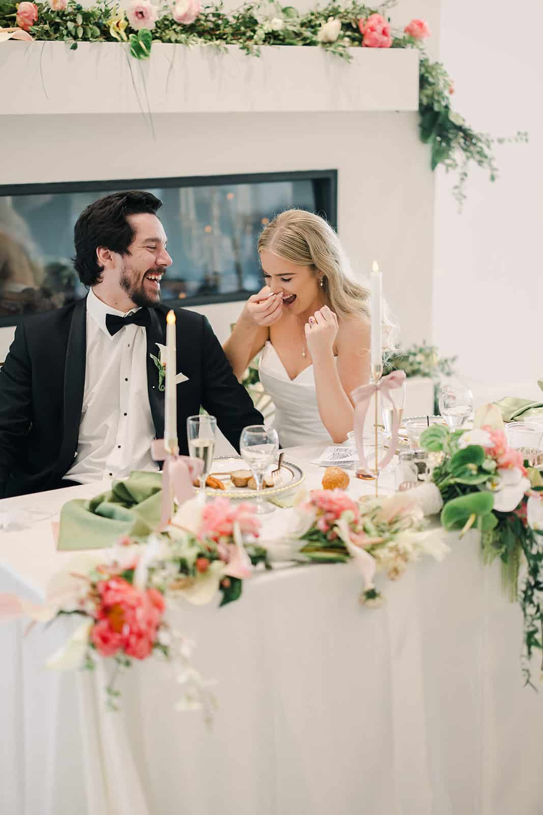 Bride and groom celebrating their wedding with smiles and laughter.