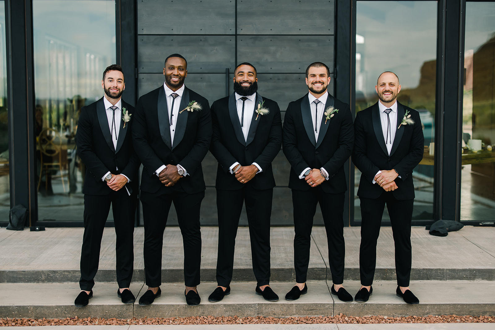 Photo of Groomsmen Preparing for Wedding at Red Earth Venue Moab