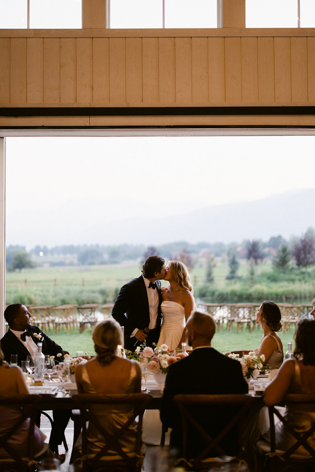 Bride and Groom Kiss after Toast at Lodge at Blue Sky Wedding