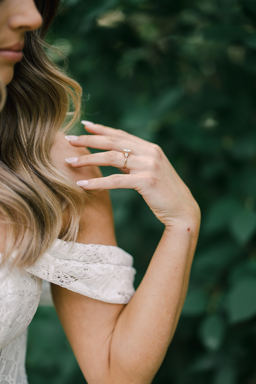 Photo of Brides Engagement Ring with Off the Shoulder Wedding Dress