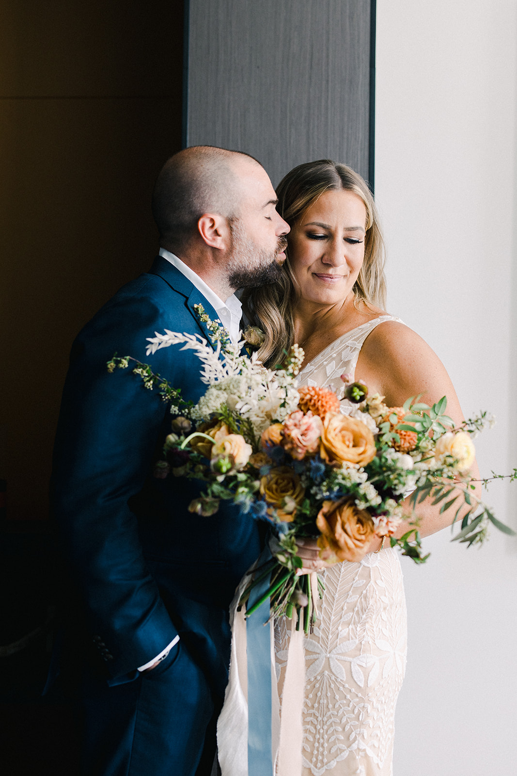 Groom Kisses Brides Cheek at Blue Sky Ranch Wedding