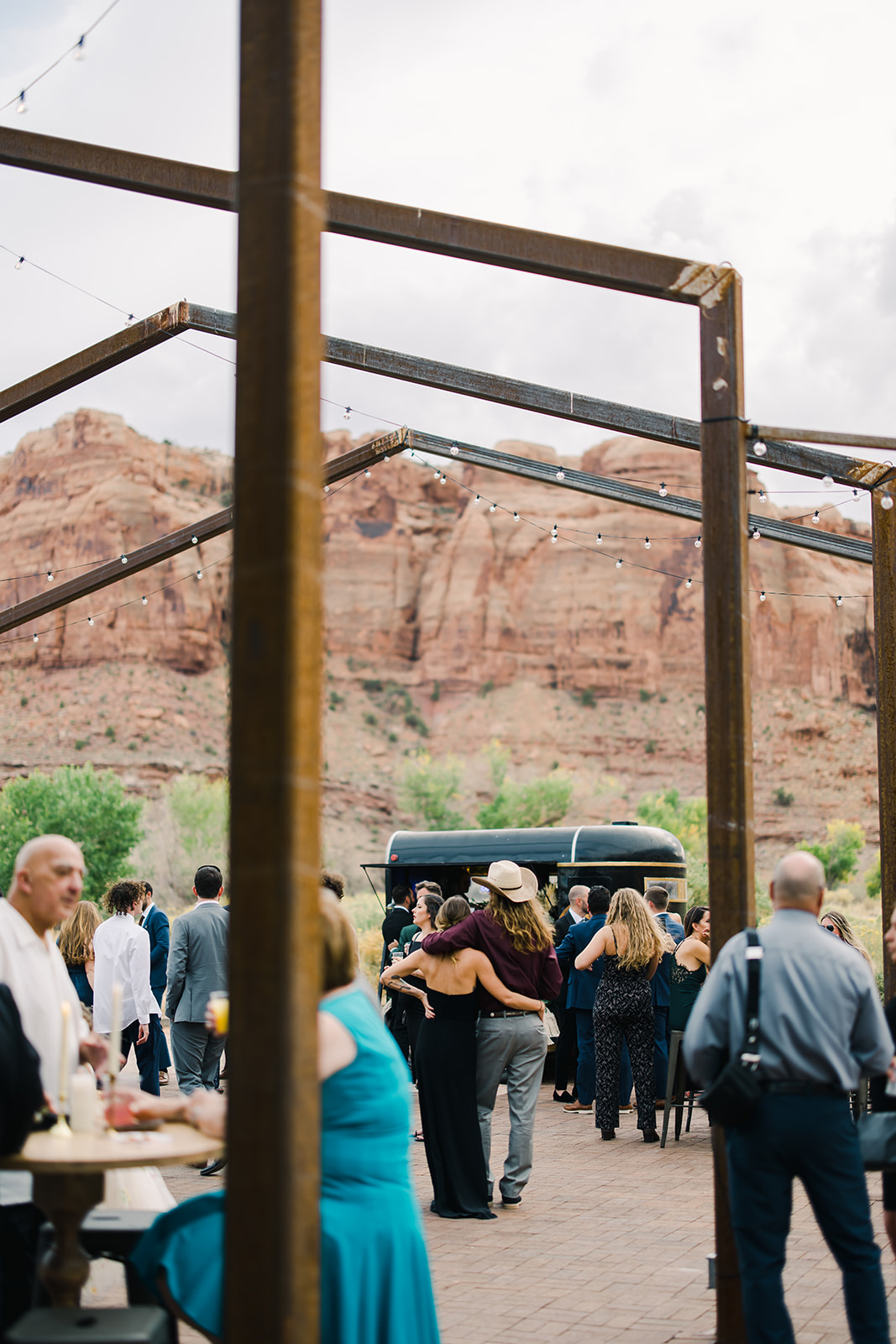 Wedding Guests Mingle at Outdoor Bar Red Earth Venue